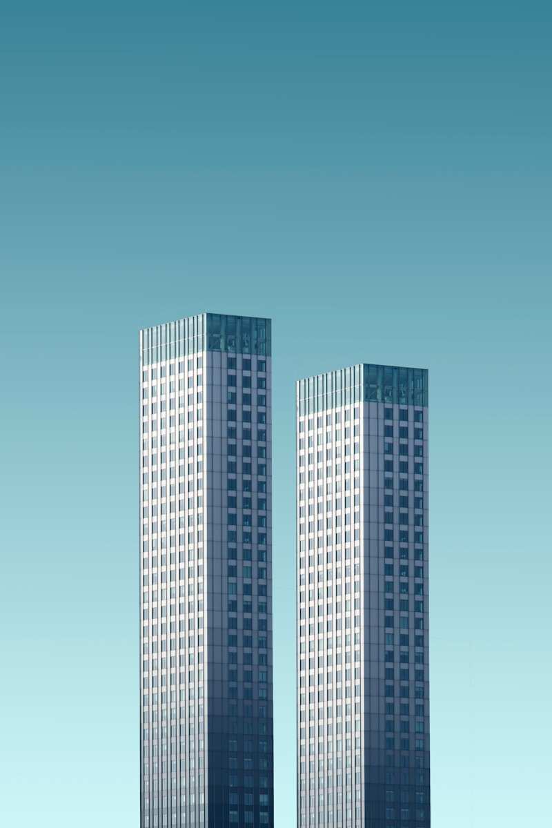 two teal-and-white skyscrapers| Aarize